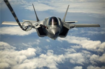 An F-35 fighter jet refueling in midair