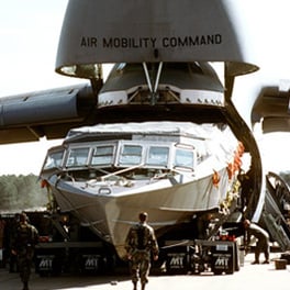 Navy Mark V SOC being unloaded from C5 transport plane