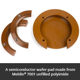 A semiconductor wafer pad made from Meldin® 7001 unfilled polyimide