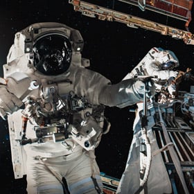 Astronauts on a space walk to repair the ISS
