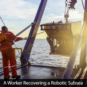 worker recovering a robotic subsea Remote Operated Vehicle (ROV)