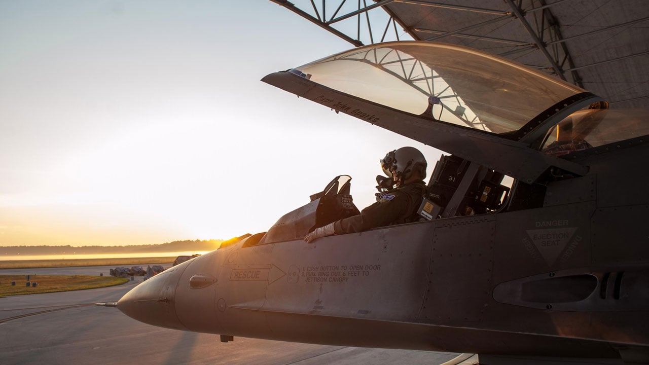 An F-16 Fighting Falcon in a hangar